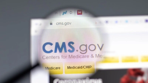 Magnifying glass over the CMS.gov site showing Medicare and Medicaid navigation tabs and agency branding